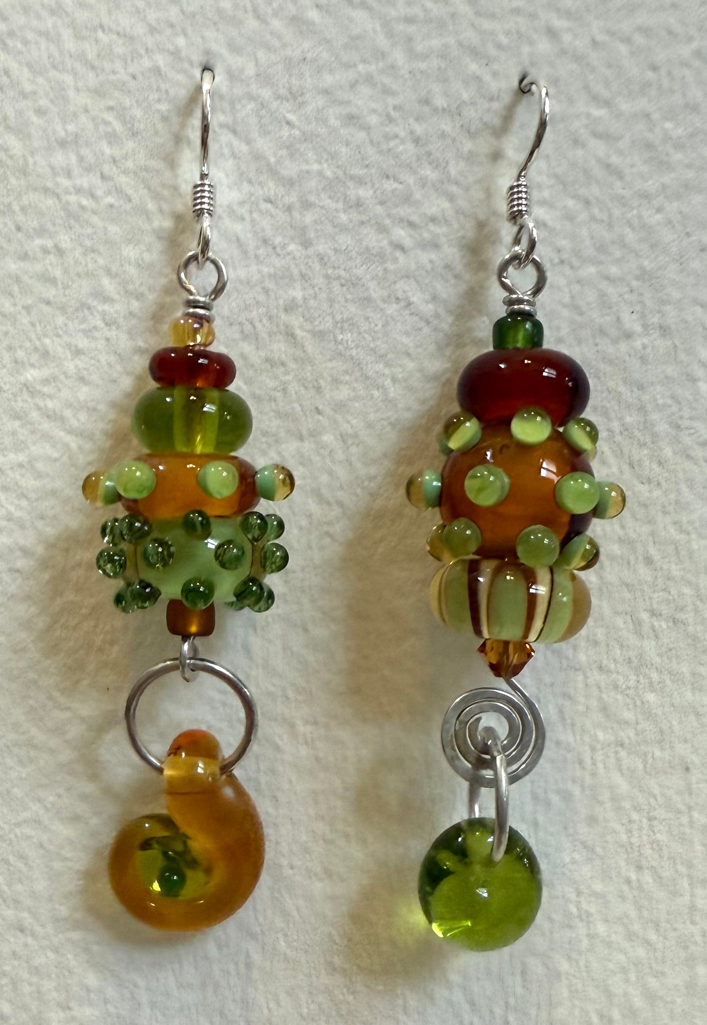 Large asymmetrical earrings (amber and olive)