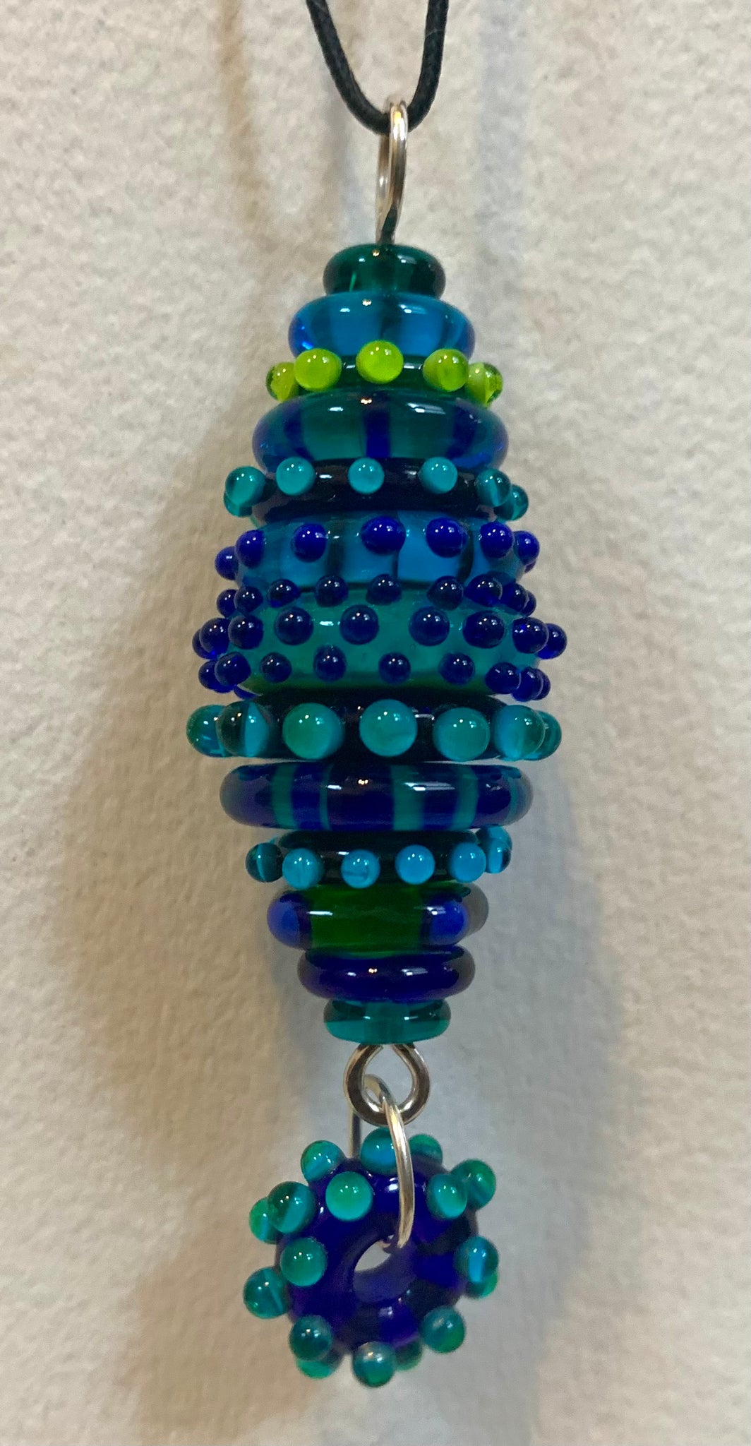 Stacked bead pendant blue green