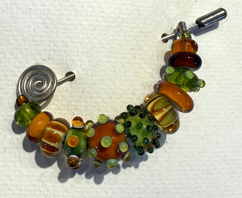 Amber/olive Pin