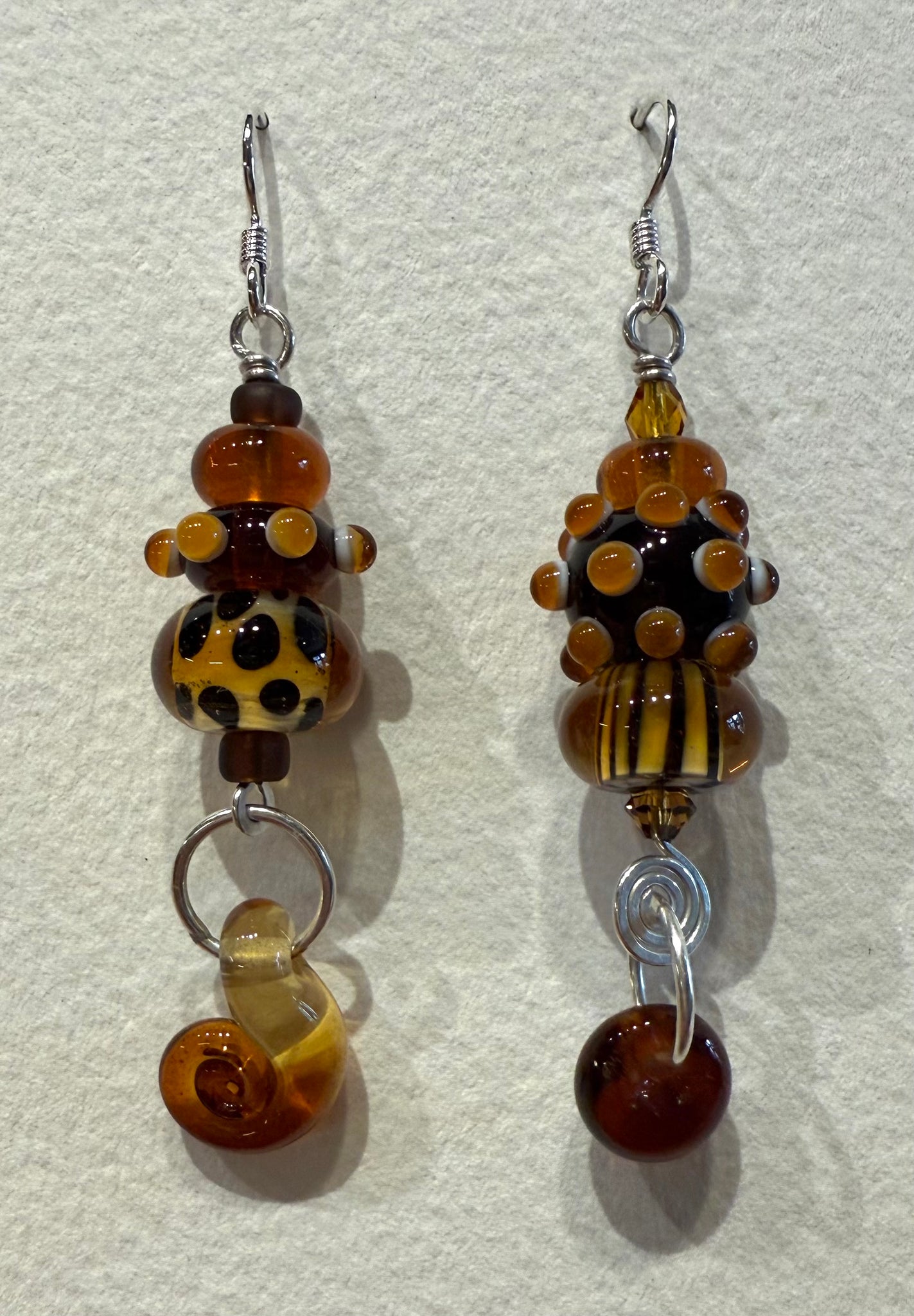 Large asymmetrical earrings (amber and brown)