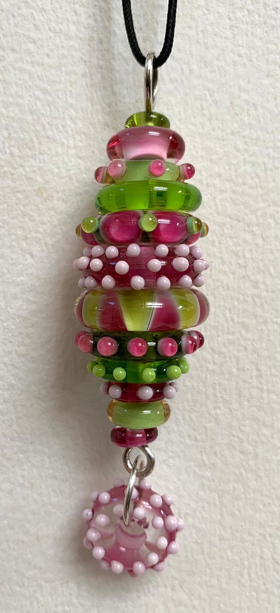 Pink and green stacked bead pendant