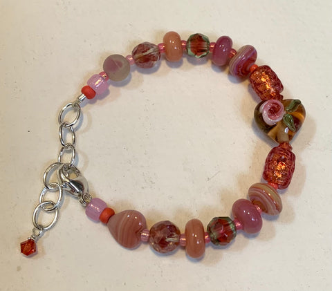 Peach glass bead bracelet with heart bead and sterling silver findings, 6 1/2”-7 7/8”